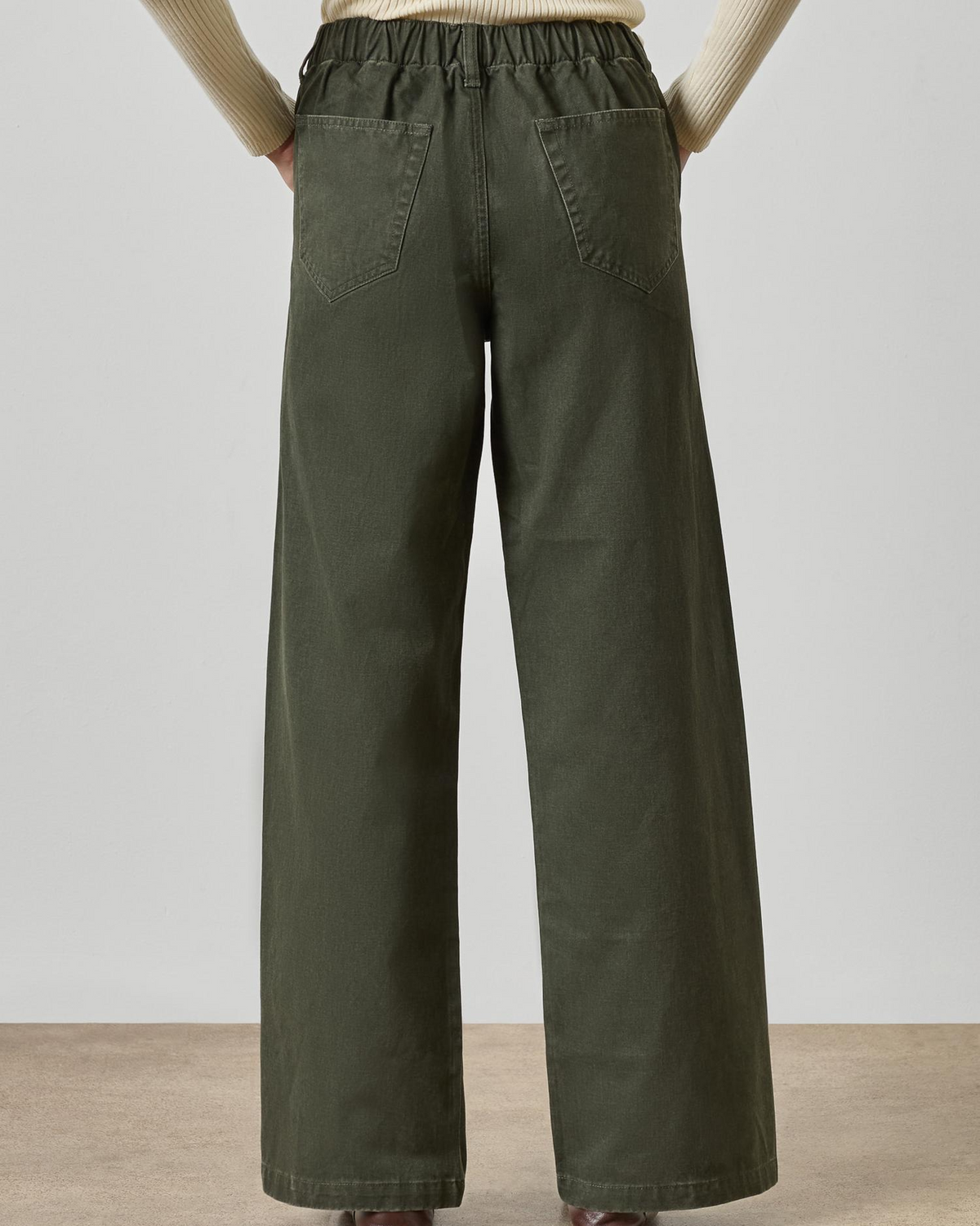 Wide-leg olive green twill pants with elastic waistband and back patch pockets