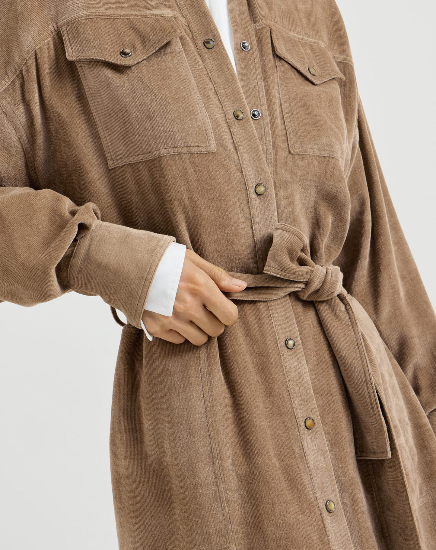 Cappuccino corduroy shirt dress with snap buttons, chest pockets, and tie waist belt