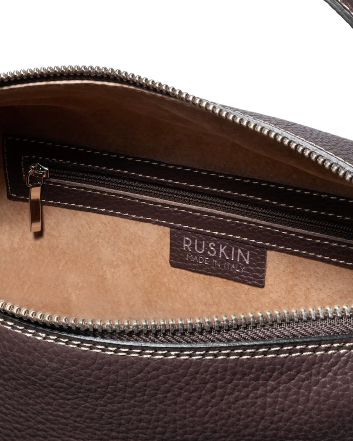Ruskin Chester bag interior in dusty fig leather with zip pocket and brand label