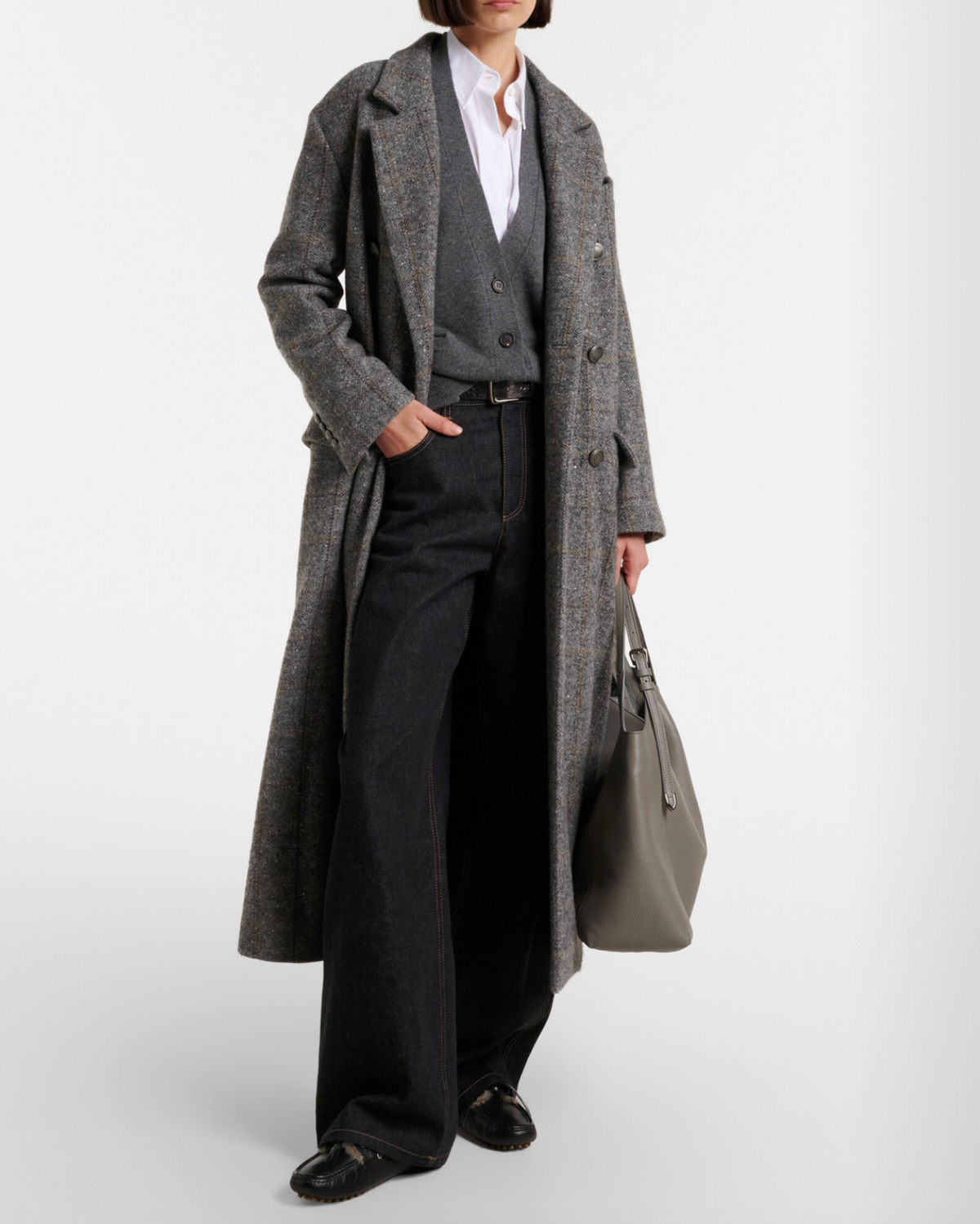 Black patent leather loafers with chunky lug sole, worn with wide-leg jeans