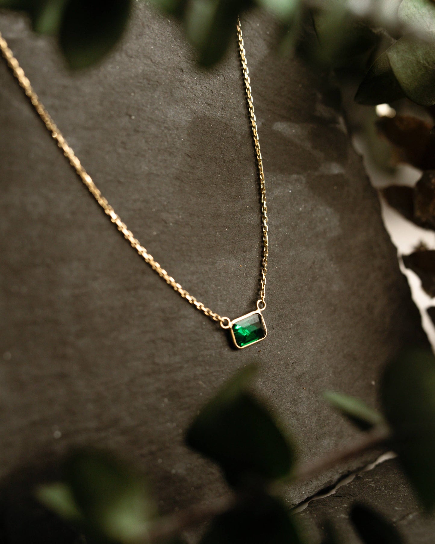 14k solid gold chain necklace with bezel-set rectangular green emerald pendant