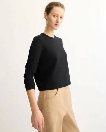 Sullivan black long sleeve cropped crewneck tee by Arlo Mott, styled with beige trousers