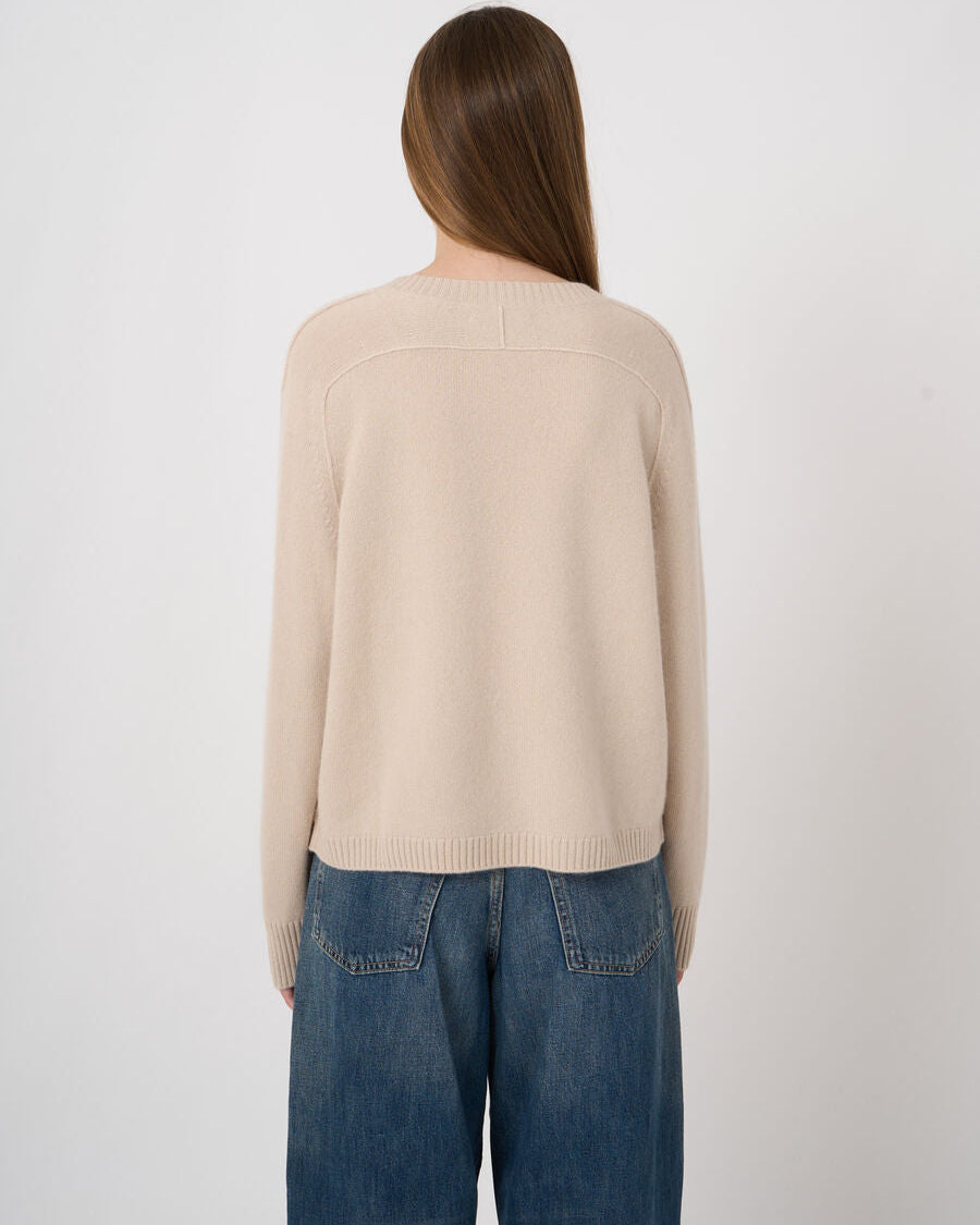 Repeat Cashmere medium-weight natural beige crewneck sweater, back view, worn with jeans