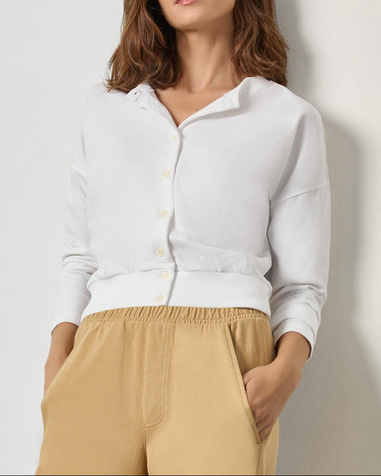 Model wearing white rib trim button-front cardigan with ribbed hem detail