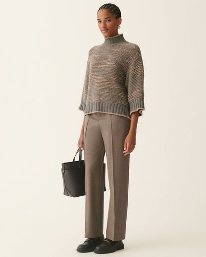 Cropped gray sequin mockneck sweater with three-quarter sleeves and ribbed hem