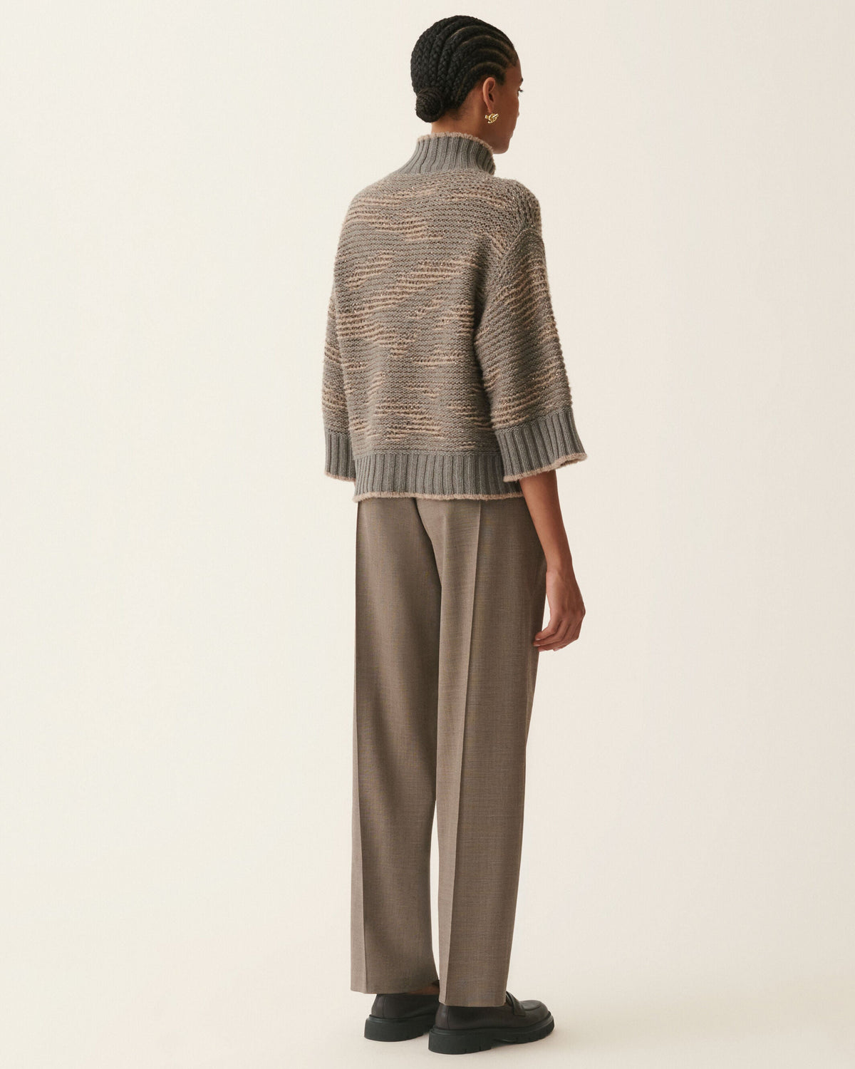 Cropped gray sequin turtleneck sweater with 3/4 sleeves and ribbed hem, back view