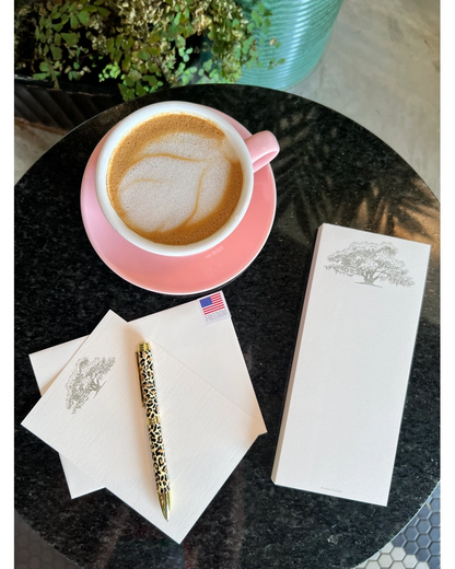 Alexa Pulitzer Oak Long Pad notepad with envelopes, leopard pen, and pink coffee cup.