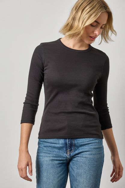 Model wearing Lilla P black 3/4 sleeve fitted crew neck top with jeans