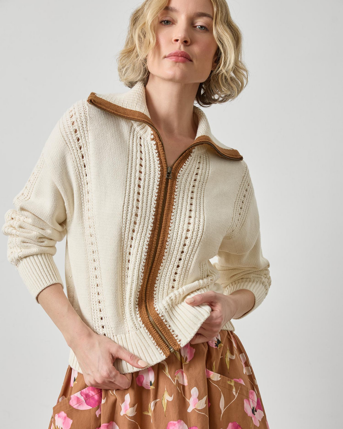 Cream zip-up knit cardigan with brown contrast collar and stripe detailing