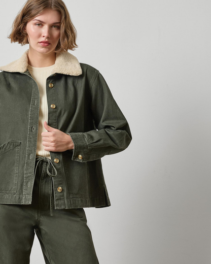 Washed olive green twill jacket with sherpa collar and gold buttons