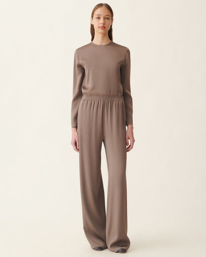 Wide-leg falcon brown satin trousers with smocked elastic waistband, worn with matching top