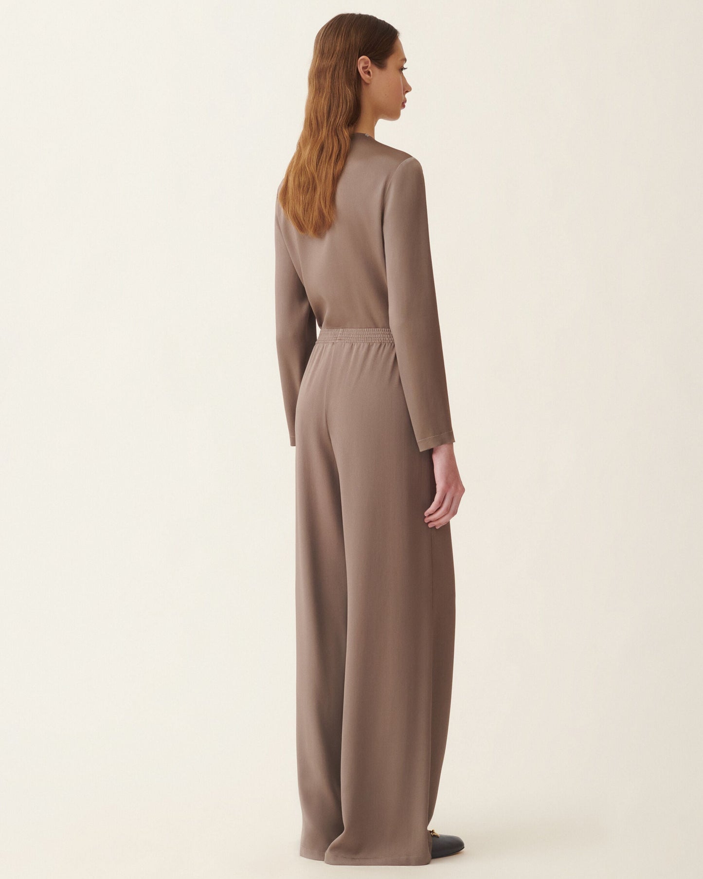 Wide-leg falcon taupe satin trousers with smocked elastic waistband, back view