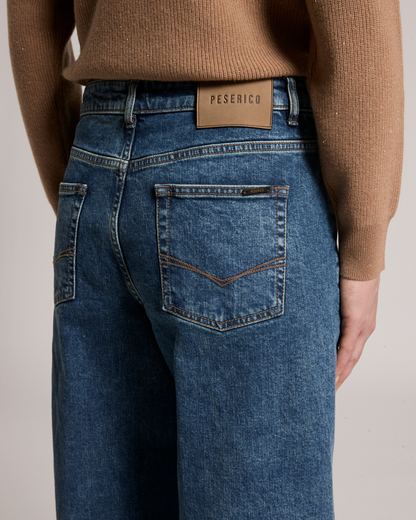 Peserico universe blue stretch denim jeans, back view with branded leather patch