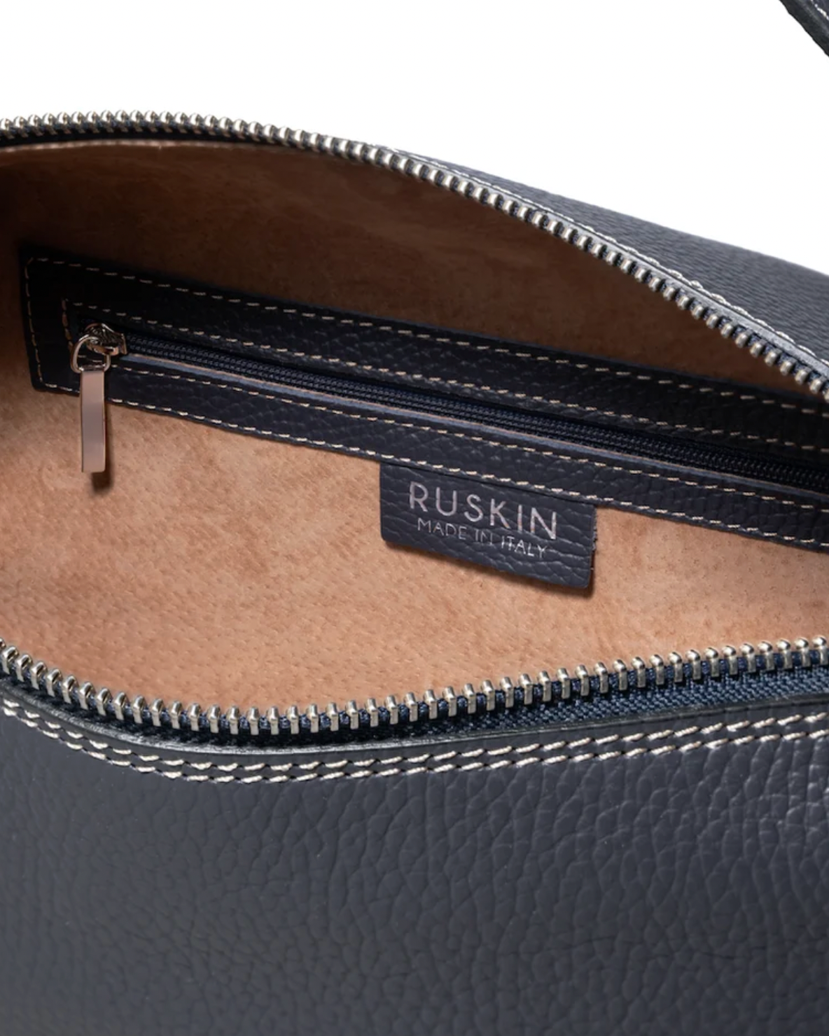 Ruskin slate blue pebbled leather bag interior showing zipper pocket and brand label