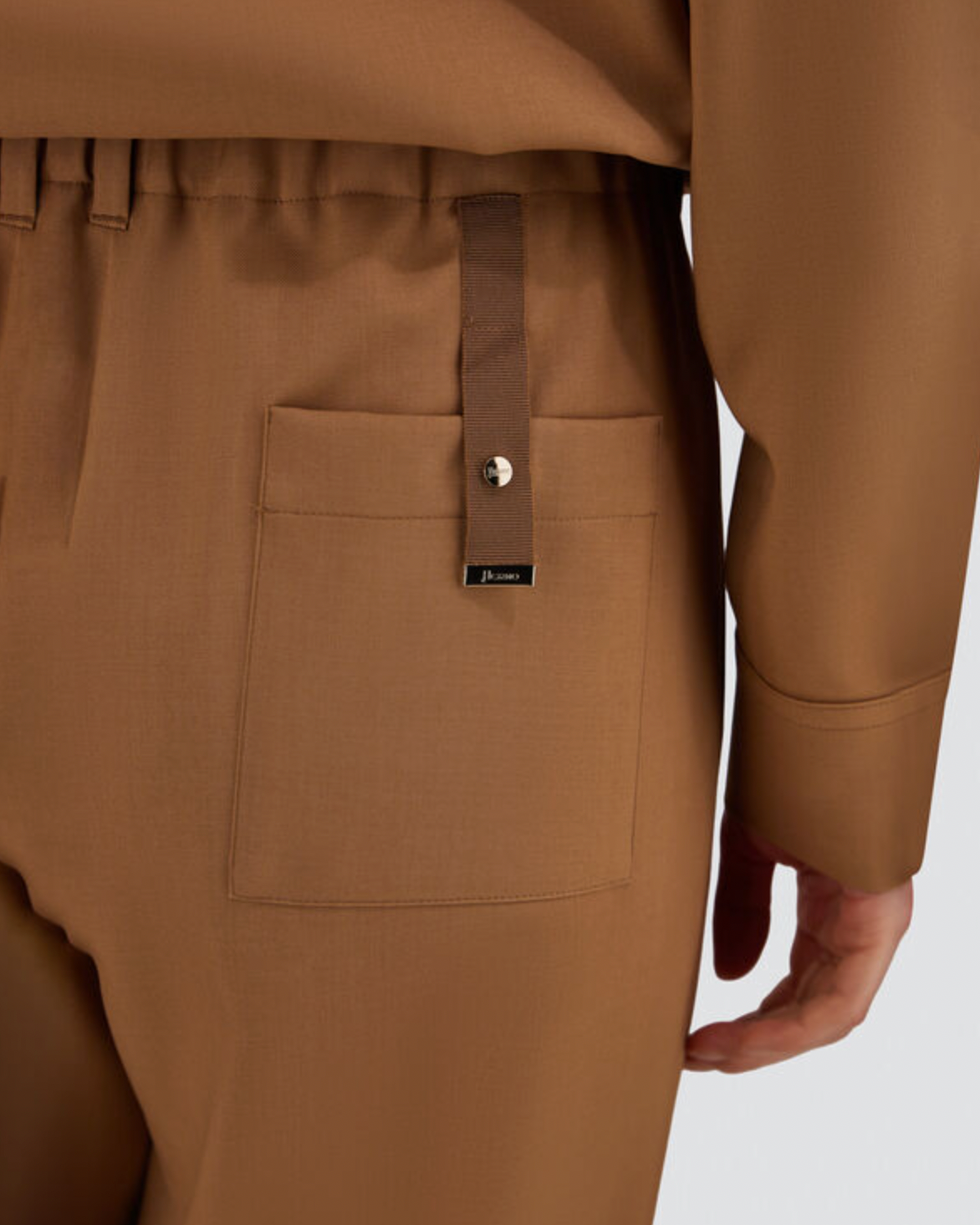 Herno camel wool pants back view with patch pocket and grosgrain strap detail