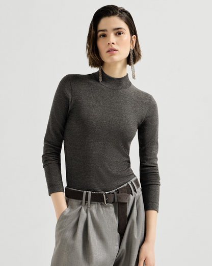 Fitted anthracite silver mockneck long-sleeve top with subtle shimmer, styled with gray trousers