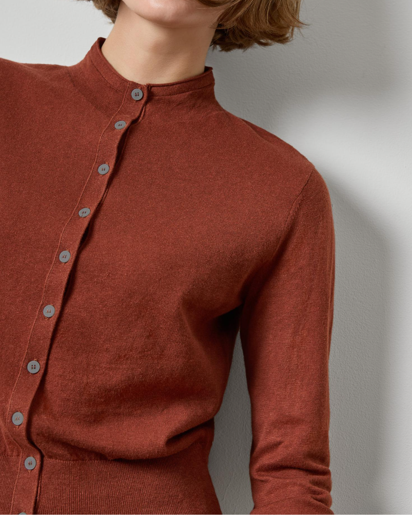 Lilla P funnel neck cardigan in rust brown with gray buttons, fitted silhouette