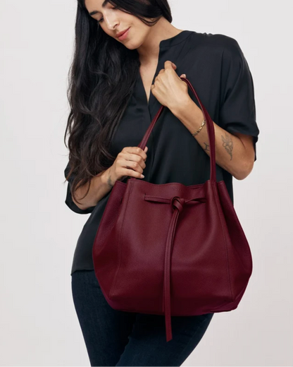 Florence Tote in plum pebble grain leather with drawstring knot detail