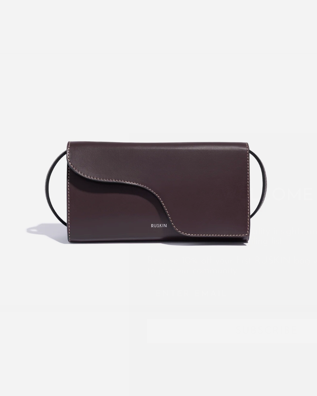 Ruskin Petite Camille clutch bag in dusty fig dark brown leather with ring strap