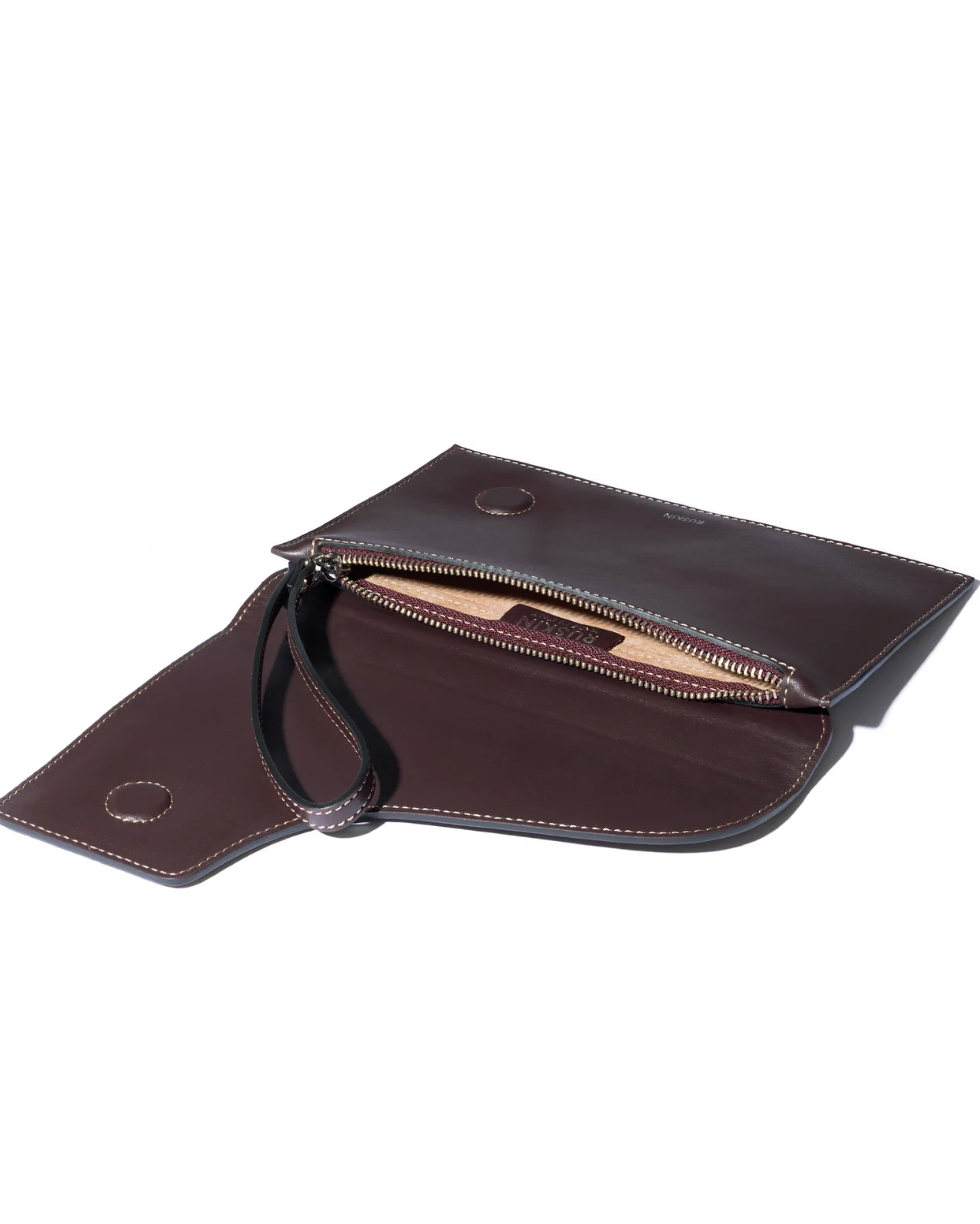 Open dark brown leather clutch wristlet with gold zipper and interior pocket
