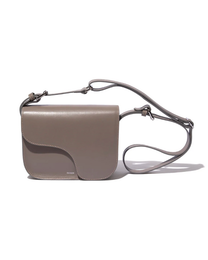 Ruskin England Camille crossbody bag in taupe leather with adjustable shoulder strap