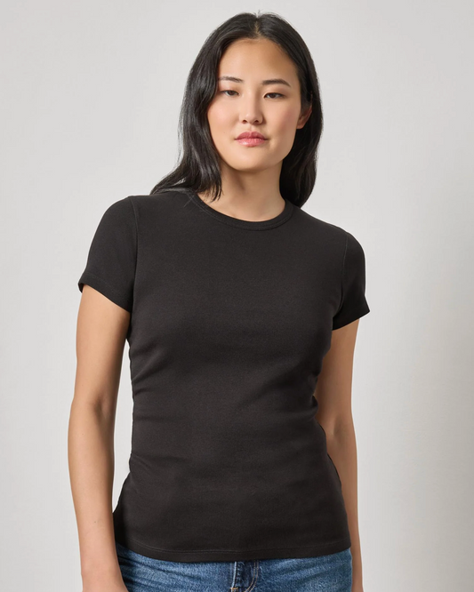 Women's fitted black short sleeve crew neck t-shirt with blue jeans