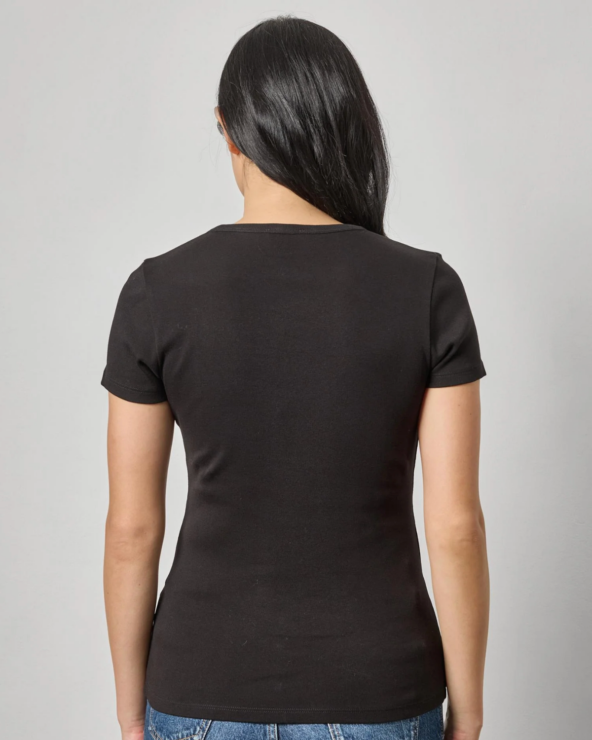 Women's fitted black short sleeve crew neck t-shirt, back view