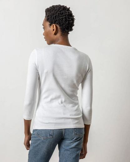 White 3/4 sleeve crew neck top shown from the back, paired with blue jeans.