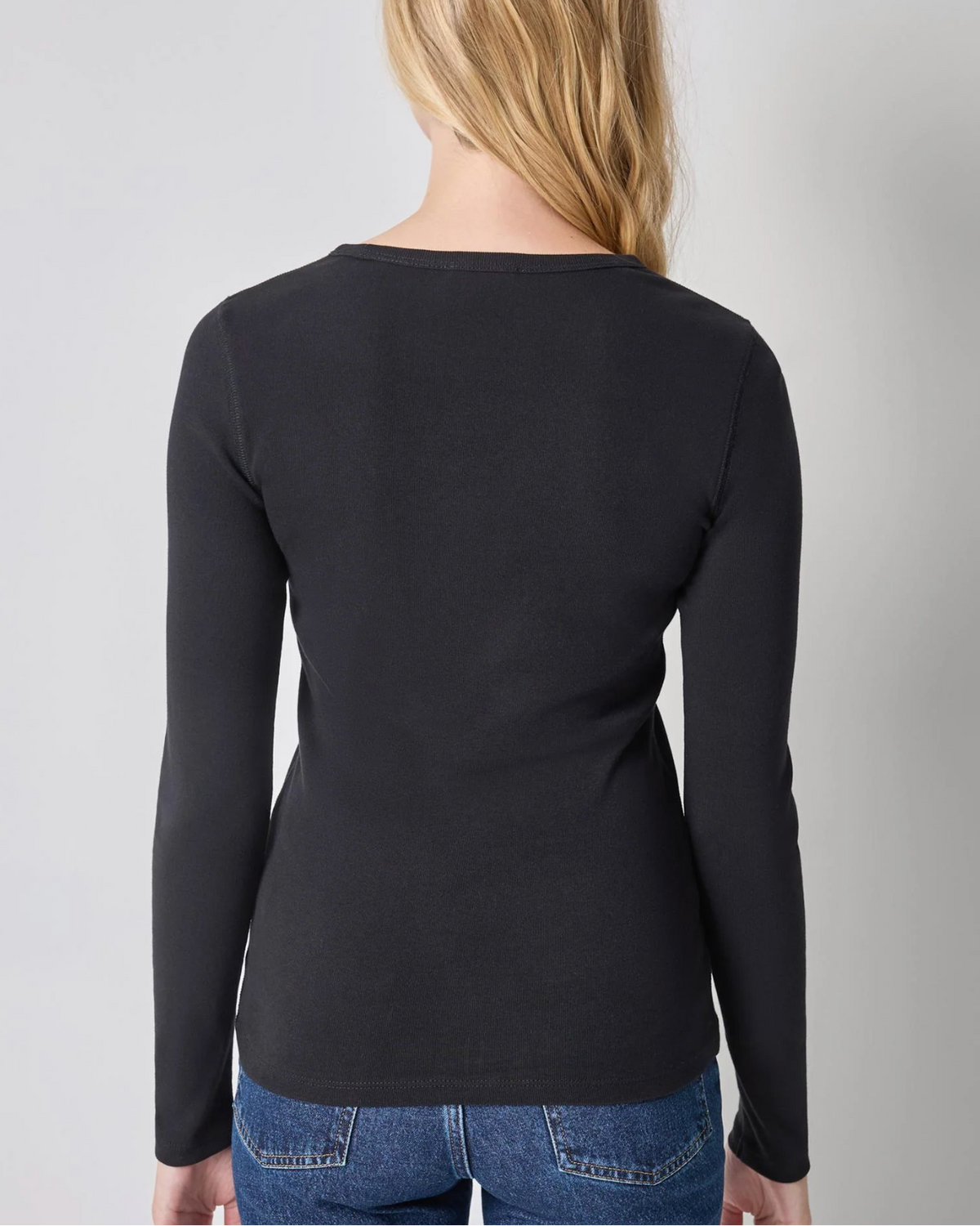 Lilla P black long sleeve fitted crew neck top, back view, paired with jeans