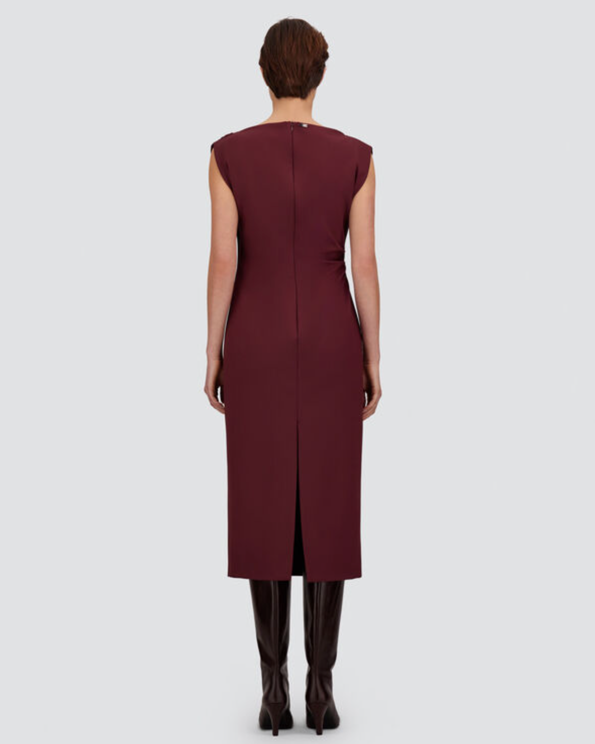 Herno bordeaux sleeveless midi sheath dress with back slit, worn with dark boots