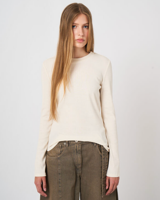 Ivory ribbed cotton-cashmere long-sleeve top with crew neck, styled with olive pants