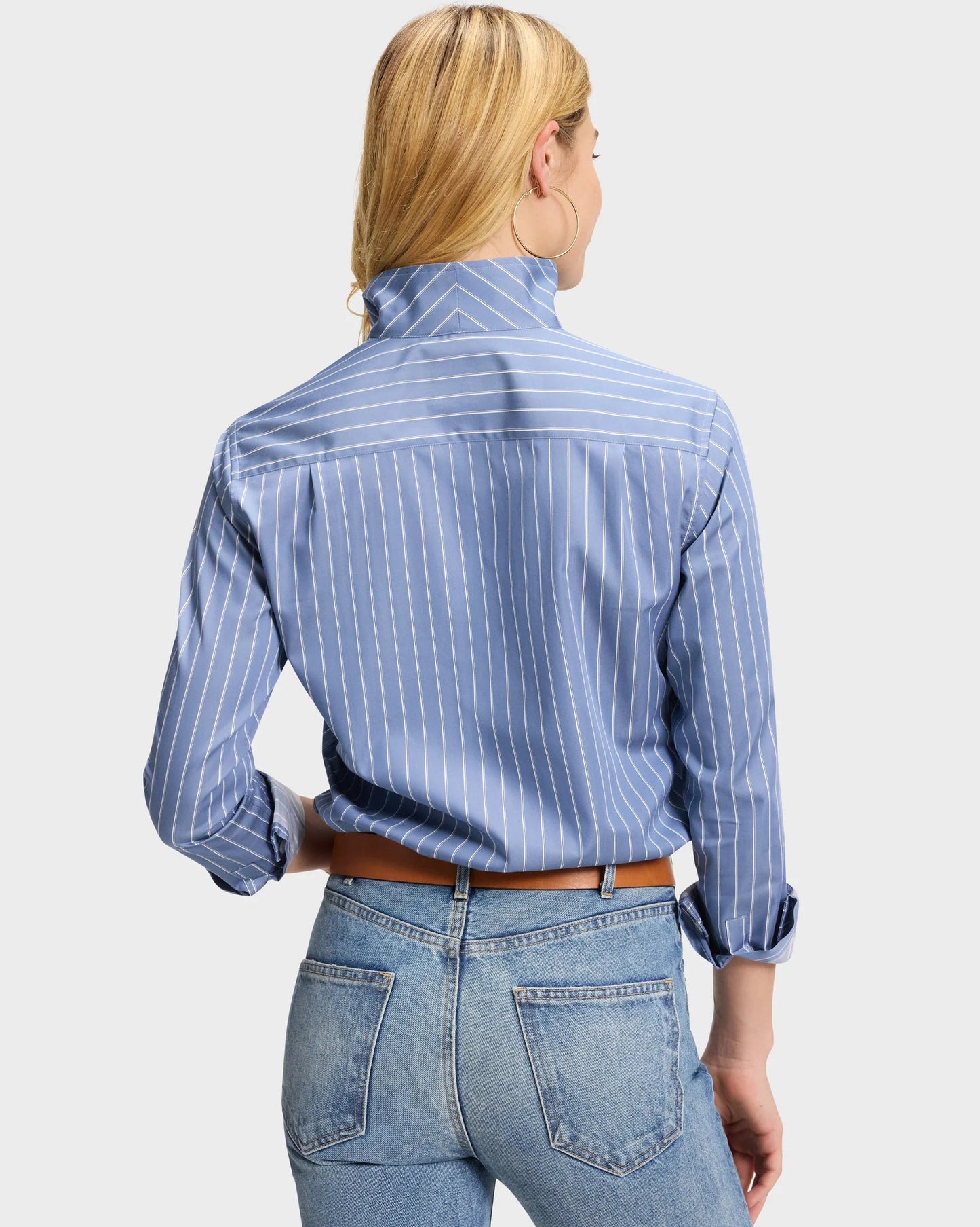 Blue pinstripe button-up shirt with rolled cuffs, back view, tucked into jeans