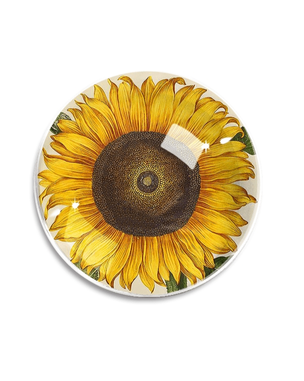 Round crystal paperweight with vibrant yellow sunflower botanical illustration on cream background