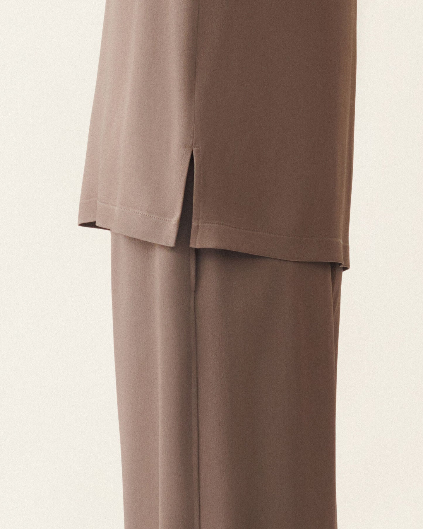 Taupe satin top with side slit hem, styled with matching wide-leg trousers