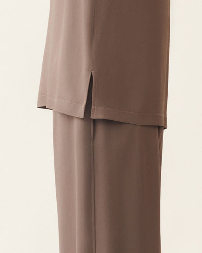 Taupe satin top with side slit hem, styled with matching wide-leg trousers