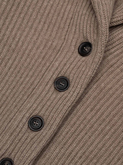Close-up detail of ribbed knit cardigan with dark buttons in brown undyed colorway